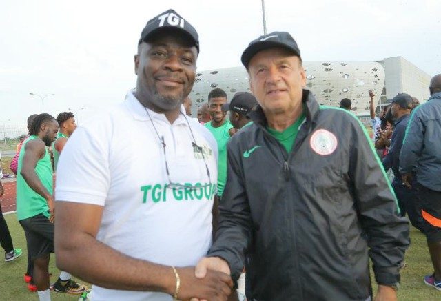 Eagles' Gernot Rohr, right, with the representative of TGI...