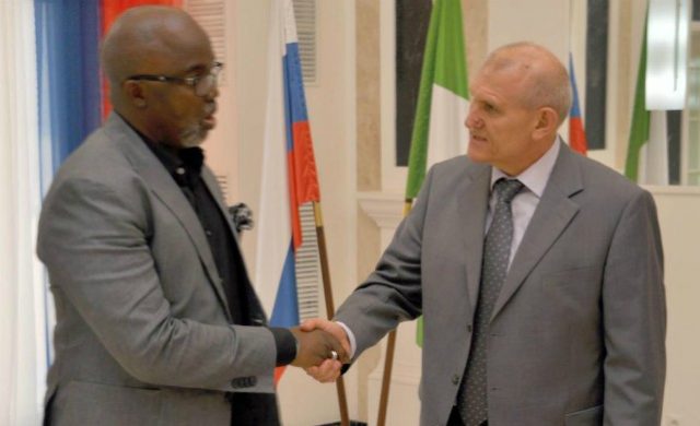 NFF's Amaju Pinnick, left, with His Excellency Nikolay Udovichenko...