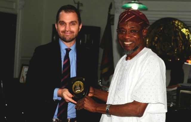 Osun Governor, Ogbeni Rauf Aregbesola, right, presenting a gift to the Political & Economic Officer, United State Consulate, Mr. Ben Williams, during the visit…