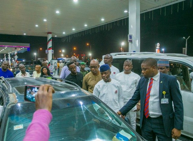 Vice President Yemi Osinbajo, in blue cap, at one of the Petrol Stations in Lagos...