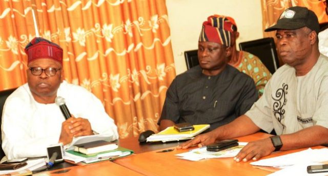 L-R: Secretary to Oyo State Government, Mr. Olalekan Alli; Head of Service, Mr. Soji Eniade; and State Chairman of the Nigeria Labour Congress, Mr. Waheed Olojede, during a meeting to resolve the dispute that triggered a three-day warning strike by the state's workforce, at the Governor's Office, Ibadan... on Friday…