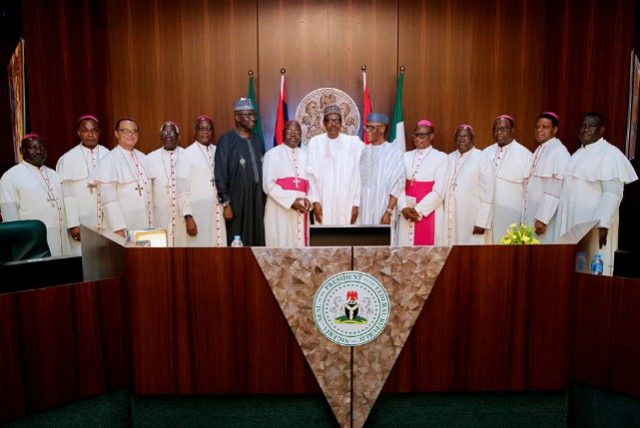 President Muhammadu Buhari, middle, in a group photograph with the Catholic Bishops and others...on Thursday...