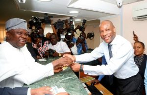 E-Tax Payment Campaign Flagged Off By Ambode At GTBank Lagos State Governor Mr. Akinwunmi Ambode (right), being presented with his Land use Charge receipt by the Managing Director, Guaranty Trust Bank (GTBank), Mr. Segun Agbaje (left) at GTBank Opebi, Ikeja, to flag off the e-tax payment campaign on Monday, February 19, 2018…