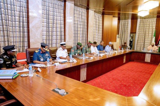 President Muhammadu Buhari, far right, with others during the security meeting...