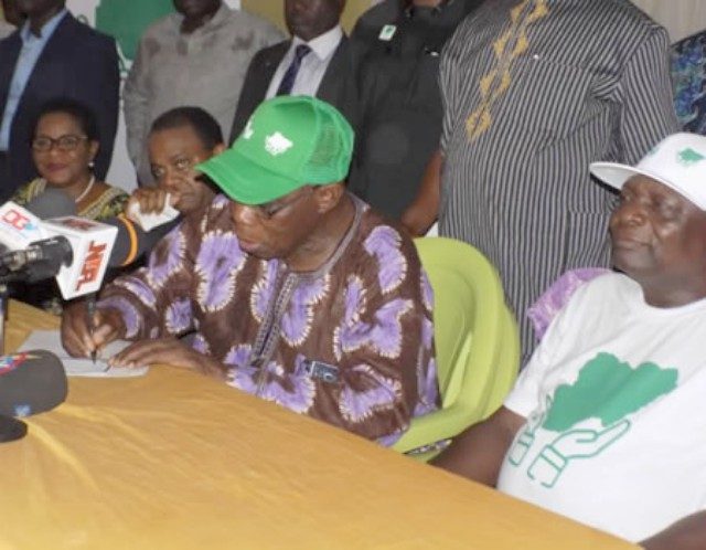 Chief Olusegun Obasanjo filling his membership form, while former Osun State Governor Prince Olagunsoye Oyinlola (right), former Cross River State governor, Mr Donald Duke and former State of Defence Minister, Mrs Modupe Adelaja look on, on Thursday, February 1, 2018