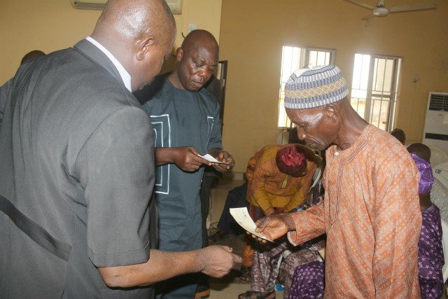 ...one of the Osun State pensioners taking his cheque...
