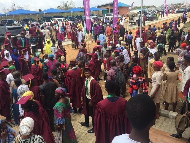 ...matriculating students of the Technical University, Ibadan...with friends and parents celebrating their feats...