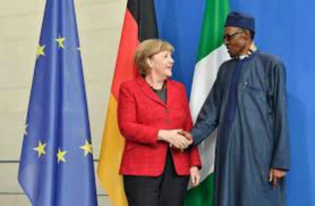 Angela Merkel, left, with President Muhammadu Buhari...