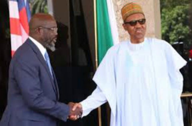 Presidents George Weah of Liberia, left, with Muhammadu Buhari of Nigeria...