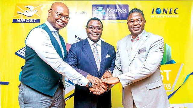 Managing Director/Chief Executive Officer, I-One-C, Kelechi Dozie(left); Group Managing Director/Chief Executive Officer, Keystone Bank Limited, Obeahon Ohiwerei, Barrister, Bisi Adegbuyi Postmaster General/Chief Executive Officer NIPOST, at the launch of Keyserv-NIPOST Agency Banking – A Financial Inclusion Partnership In Lagos.