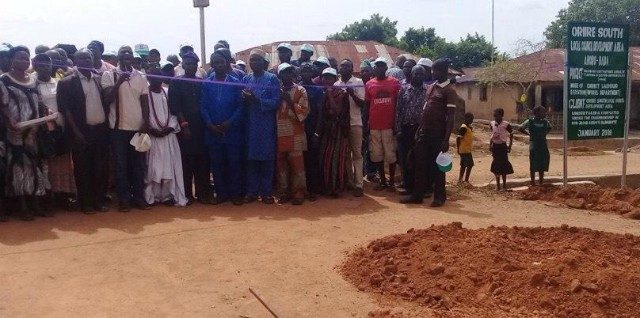 The caretaker chairman of Oriire South LCDA, Hon. Jacob Bamigboye, cutting the tape to flag off the road construction project…