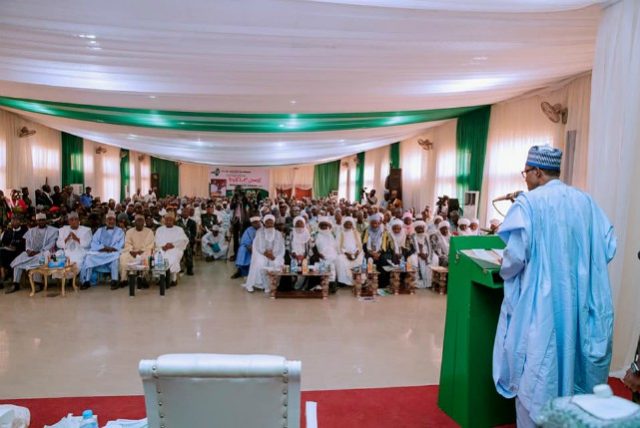 President Muhammadu Buhari, right, addressing stakeholders in Zamfara State...