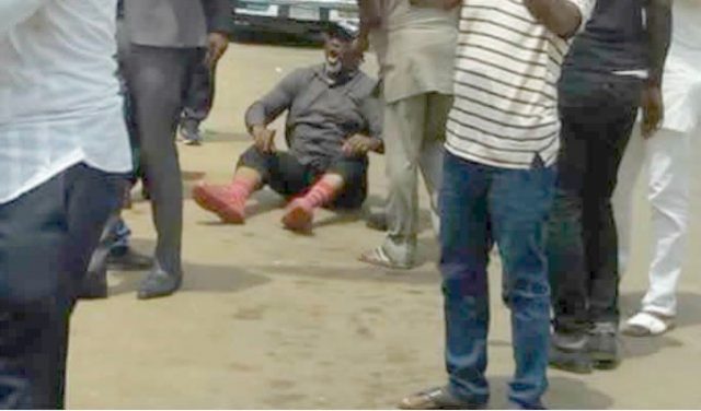 ...Senator Dino Melaye...on the floor in Abuja on Tuesday after his 'escape drama'...