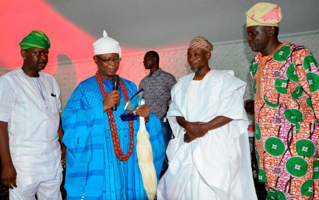 R-L: Vice President B Zone of the Nigerian Union of Journalist, Comrade Cosmos Oni; Governor Rauf Aregbesola of Osun; the Ajero of Ijero, Oba Adewole Adebayo and Chairman Osun NUJ, Comrade Abiodun Olalere, during the presentation of Golden Merit Award to Governor Aregbesola for unprecedented Infrastructural Development, at the Atlantis Civic Centre, Osogbo…during the week…