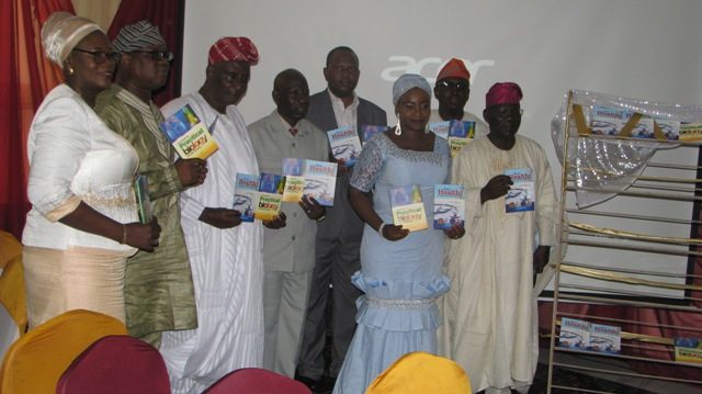 Chairman of the occasion, Alhaji Tayo Showumi (right) and the author, Ikimot Azeez with launchers during the unveiling of the books