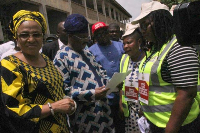 L-R: Mrs Florence Ajimobi, Governor Abiola Ajimobi and Chief Adebayo Adelabu, a frontline guber-aspirant in Oyo APC with OYSIEC officials during Saturday's LG Poll in Oyo State...