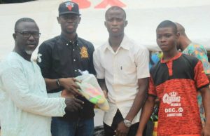 Dapo Lam Scores Another Point, Donates Multimillion Naira Kits To Uplift Sports Clubs SWAN Chairman, Niyi Alebiosu assisting Hon. Dapo Lam Adesina to present sporting kits to one of the benefitting clubs…