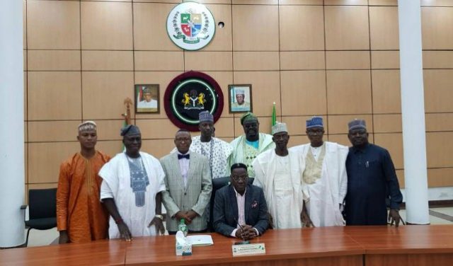 Governor Abdulfatah Ahmed of Kwara State, seated, with his new aides...