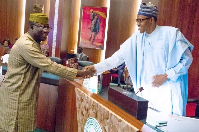 Former Minister of Solid Minerals, Dr Kayode Fayemi, left, with President Muhammadu Buhari...