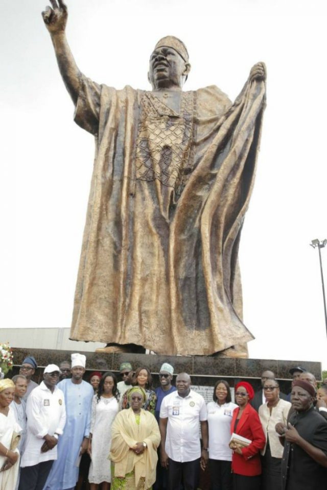 Governor Akinwunmi Ambode of Lagos State and others with the statue of Basorun MKO Abiola...