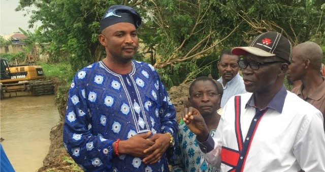 The Commissioner for Environment in Oyo State, Mr Isaac Isola, right, discusses with a community leader during the tour at Ajofoyinbo, Soka Area, in Ibadan…