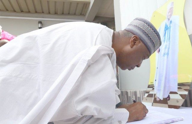 The President of the Senate, Dr Bukola Saraki signing the condolence register at the the home of the late jurist…