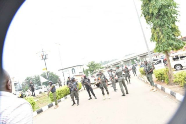 ...Governor Ayodele Fayose, left, confronting the security agents...on Wednesday...