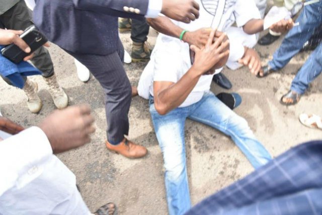 …Governor Ayodele Fayose, on the floor after being allegedly tear-gassed’ by security agents…