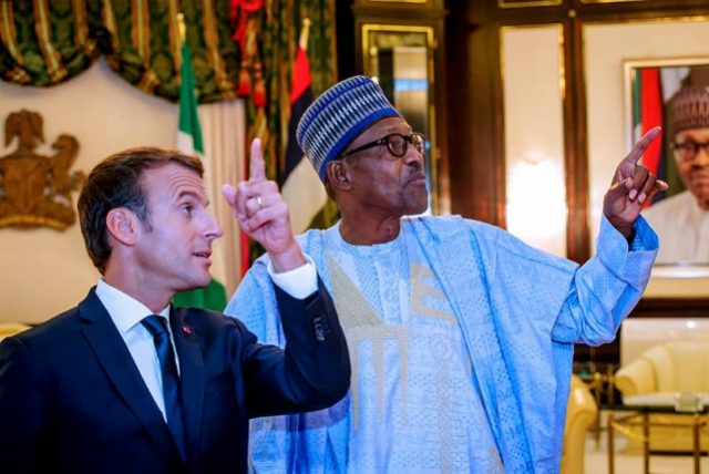 President Emmanuel Macron of France, left, with President Muhammadu Buhari...