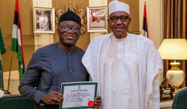 The winner of the Ekiti Guber election…Dr Kayode Fayemi, left, with President Muhammadu Buhari, proudly displaying his Certificate of Return given to him by INEC…