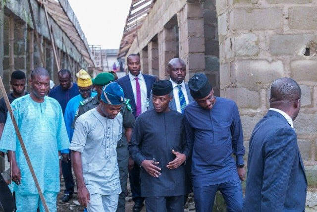 VP Yemi Osinbajo with stakeholders of the community during the inspection of the market…