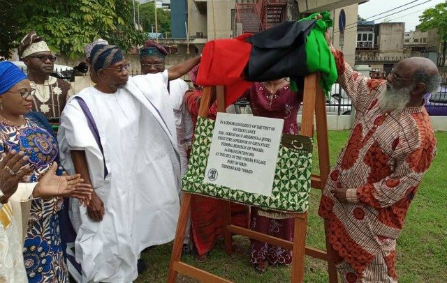 Governor Rauf Aregbesola unveiling the plaque. On his right is his wife, Sherifat Aregbesola. Assisting him is Khafra Kambon, Chairman of (ESCTT)…