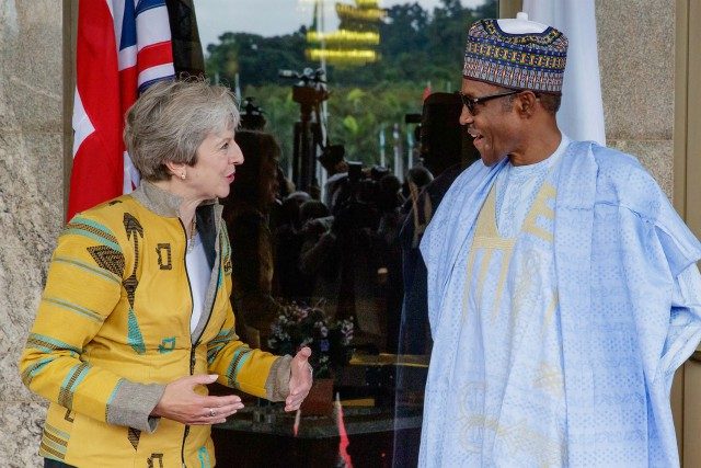UK's Prime Minister, Theresa May, left, with President Muhammadu Buhari...