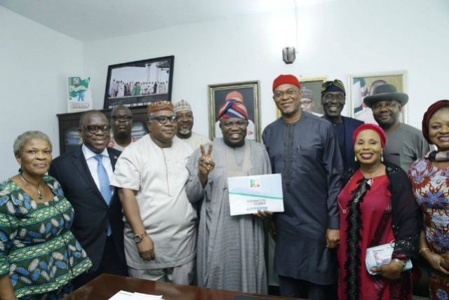 Governor Akinwunmi Ambode, middle, with admirers...