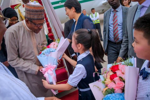 President Muhammadu Buhari being welcomed by a Chinese school girl in Beijing…