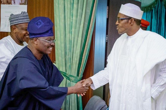 Governor Abiola Ajimobi, left, with President Muhammadu Buhari...