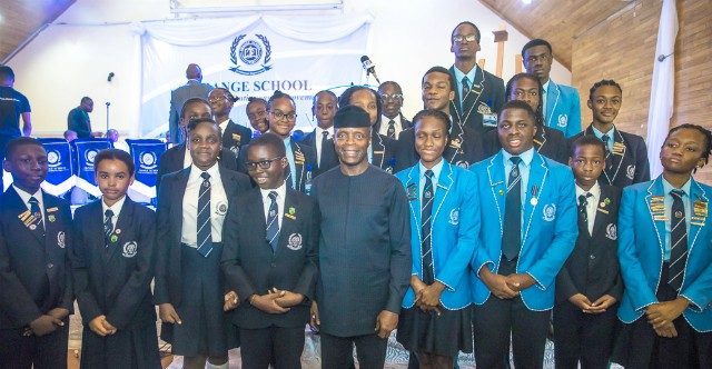 Vice President Yemi Osinbajo, with some students of the Grange School...during the event...