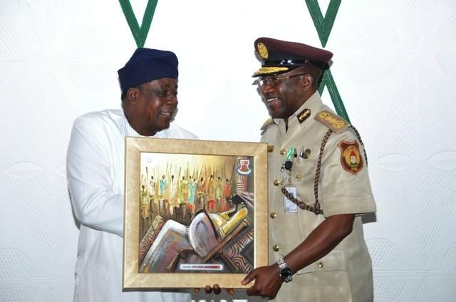 The Deputy governor of Oyo State, Otunba Moses Alake Adeyemo (left) presenting a gift to the Comptroller General of Nigeria Immigration Service, Muhammed Babandede during his courtesy visit to governor's office, Ibadan on Monday…