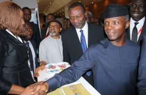 24th NES: Stanbic IBTC Underlines Support For Diligent Implementation Of Public Policy Vice President Yemi Osinbajo, right, with others at the stand of Stanbic IBTC...