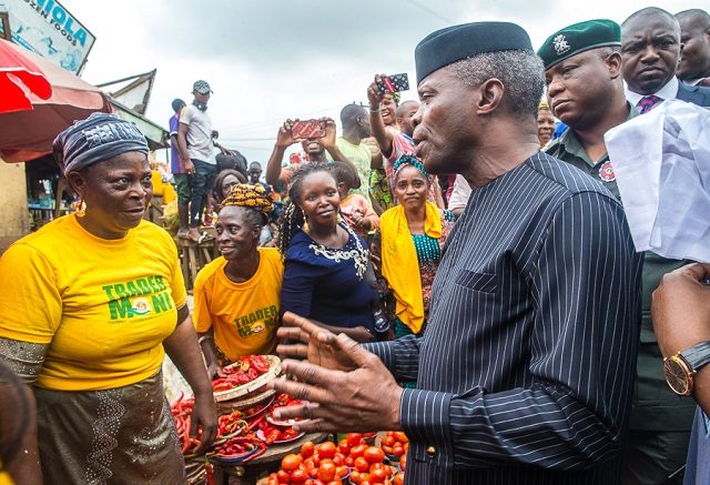 Vice President Yemi Osinbajo...freely interacting with Ibadan market women in his his usual style...