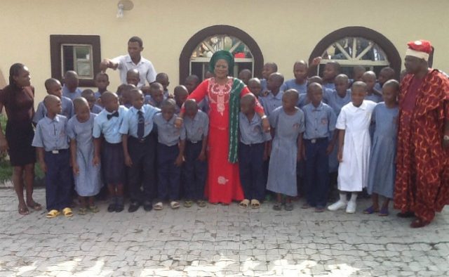 Osun State's Deputy Governor and Commissioner for Education, Mrs Titi Laoye-Tomori, middle, Oba Adedokun Abolarin, right, with the staff and students of Abolarin College...recently...