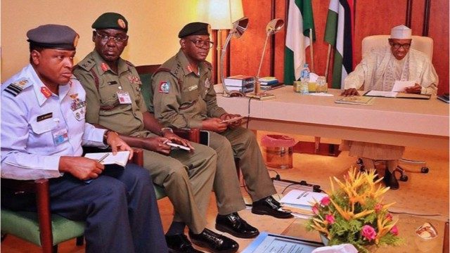 President Muhammadu Buhari, right, with Security Chiefs...recently...