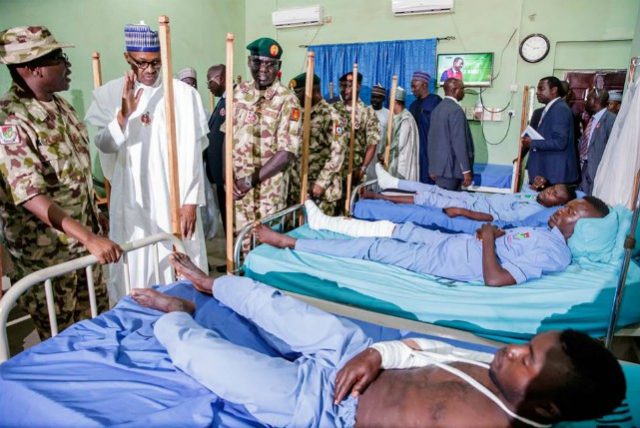 President Muhammadu Buhari with some of the wounded Metele soldiers