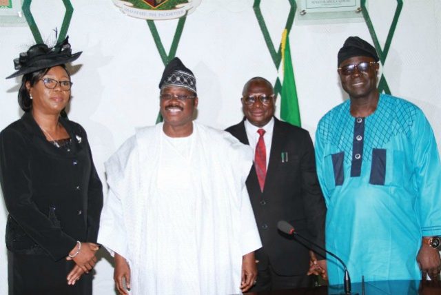 L-R: President, Customary Court of Appeal, Oyo State, Justice Eni Esan; state Governor, Senator Abiola Ajimobi; Chief Judge, Justice Munta Abimbola; and Speaker of the state's House of Assembly, Rt. Hon. Olajunju Ojo, during the inauguration of Esan, at the Governor's Office, Ibadan... on Monday…