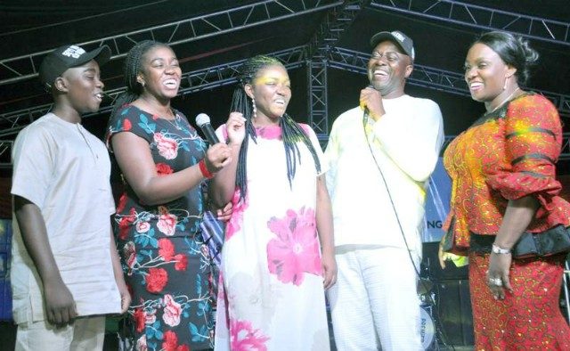 Engineer Seyi Makinde, his wife and children...singing at the event...