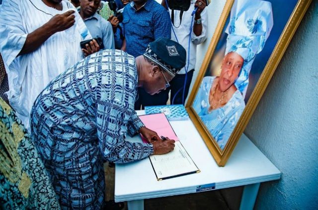Governor Abiola Ajimobi...signing the condolence register at the residence of the late Iyalode...