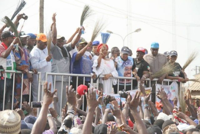 Oyo State Governor, Senator Abiola Ajimobi (in orange cap), with All Progressives Congress leaders and supporters during the party's campaign for the forthcoming election, at the Plank Market, Bodija, Ibadan... on Monday