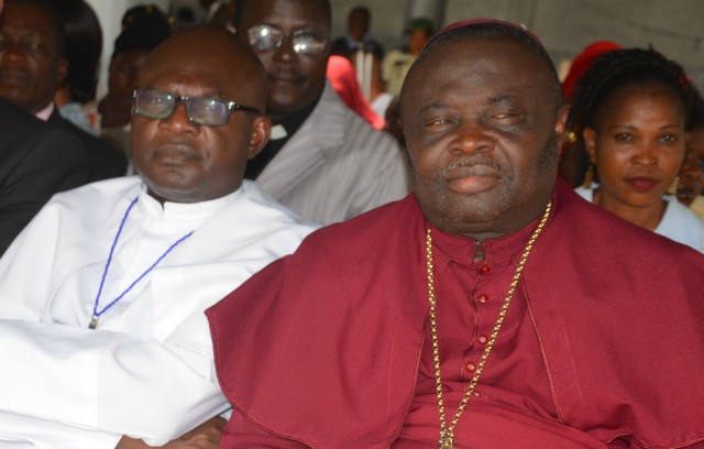 Bishop Dr Ademola Moradeyo right with another cleric at the event