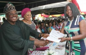 Oyo Government Holds Interfaith Service, Gives Awards To Hard Working Staff Members Governor Abiola Ajimobi, left, with his wife, Florence...as he gives Modupe Fehintola of BCOS her well-deserved award...