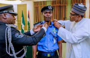 New IGP Unveiled By Buhari, Promises To Be Fair During Polls Mr Abubakar Mohammed Adamu, the new Acting IGP being decorated by President Muhammadu Buhari, right...